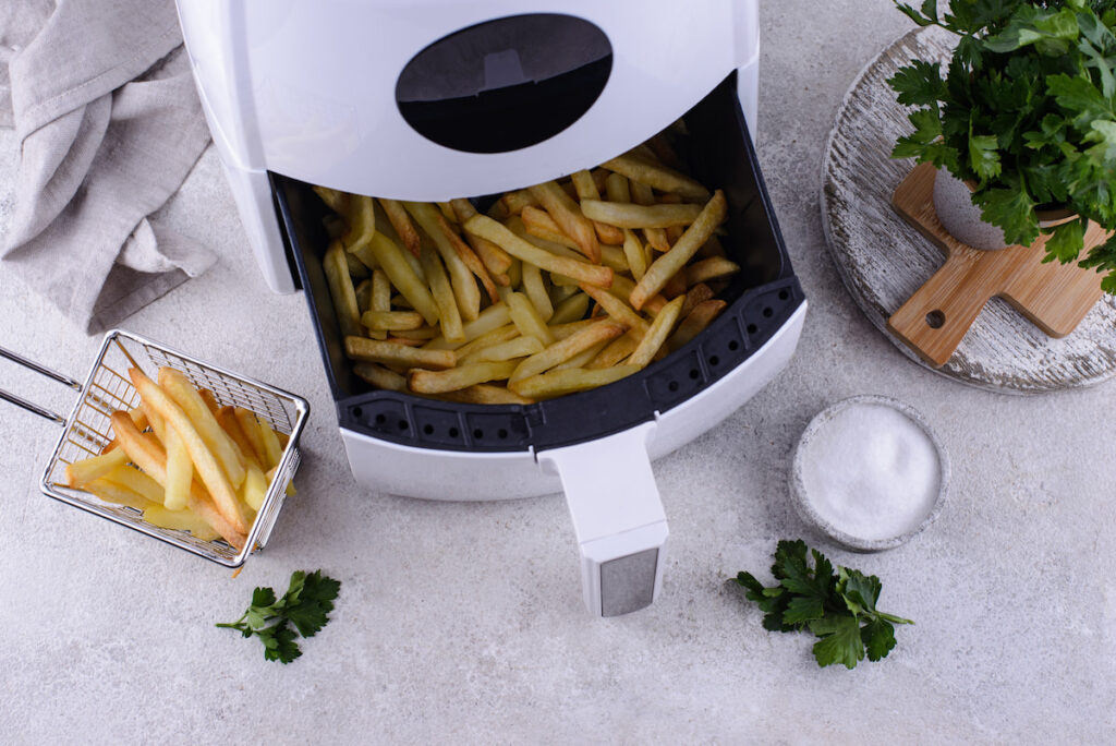 french fries cooked in a white air fryer